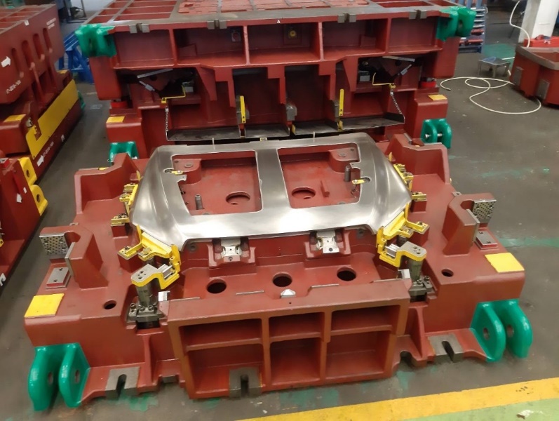 Open stamping die with formed panel in cavity